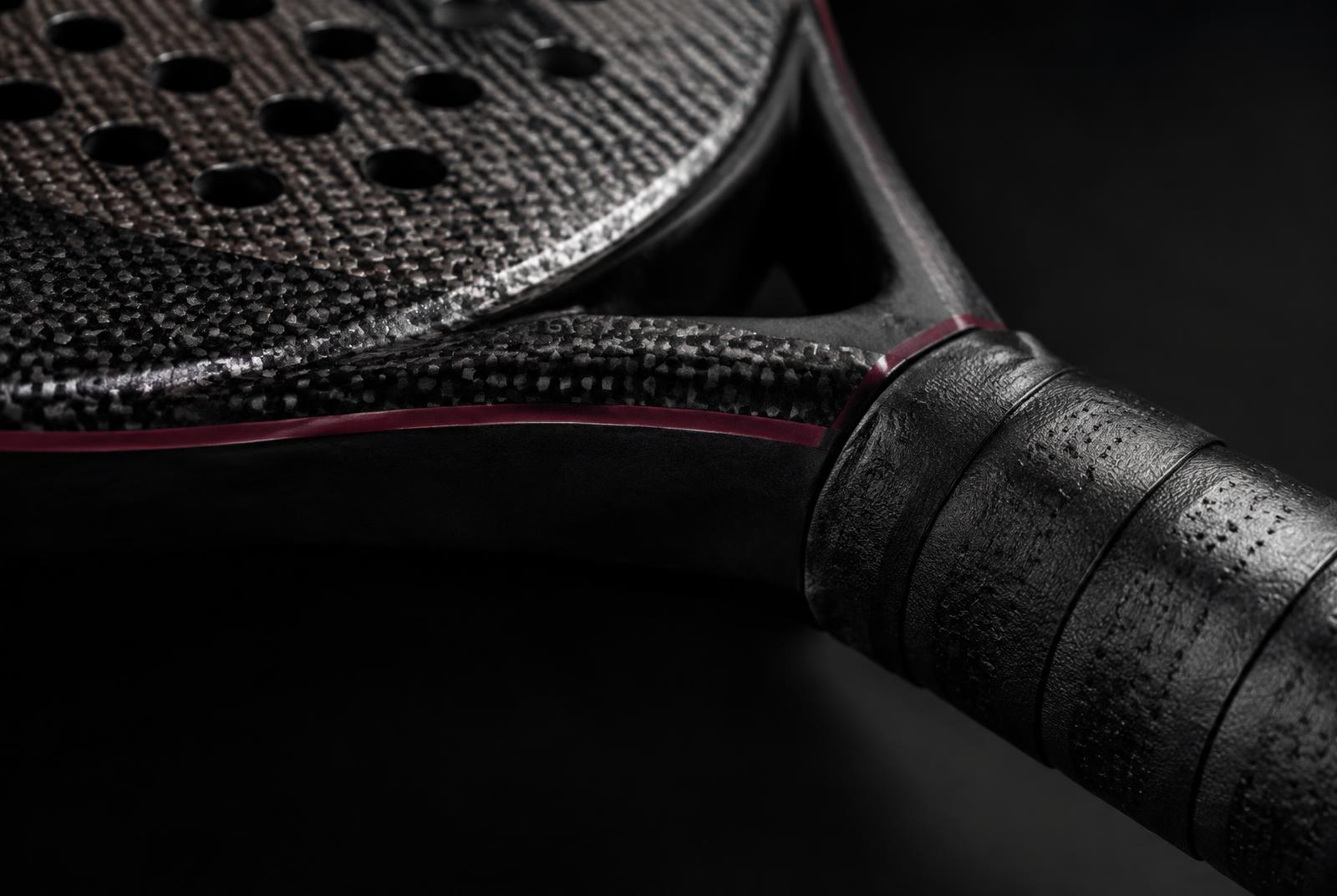 Close-up of a racket frame, surface texture and grip